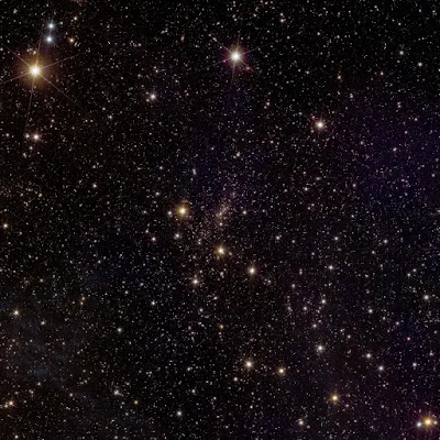 The stunning Abell 2390 cluster is in the middle, amid thousands of galaxies further away in the universe. There are a few stars too with equally stunning artifacts, like the diffraction spikes and blue rings.