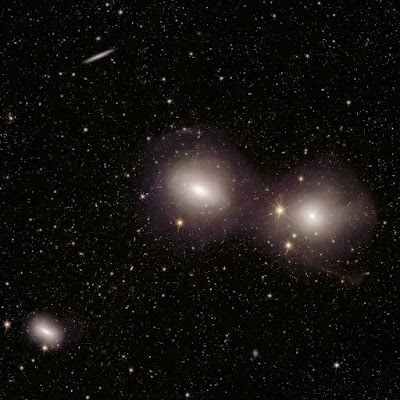 Merging galaxies forming part of the Dorado Group. Euclid has shown the shells and tails of these interacting objects.