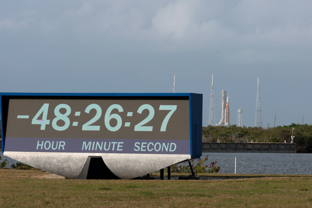 NASA Artemis 2 countdown clock showing -48:26:27 with the SLS rocket on Launch Pad 39B at Kennedy Space Center in the background, March 2026