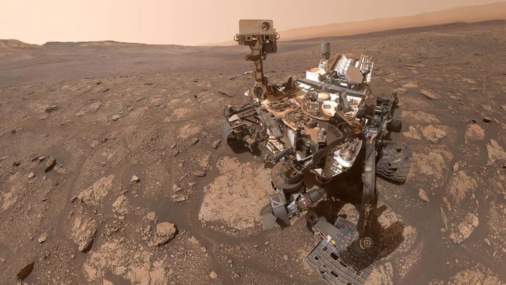 Mars rover exploring rocky terrain.