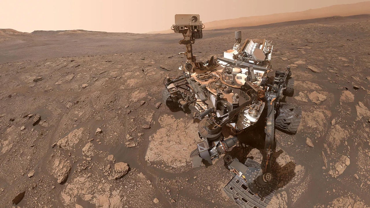 Mars rover exploring rocky terrain.