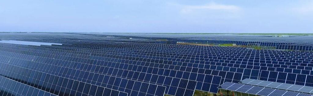Expansive solar panel field landscape.