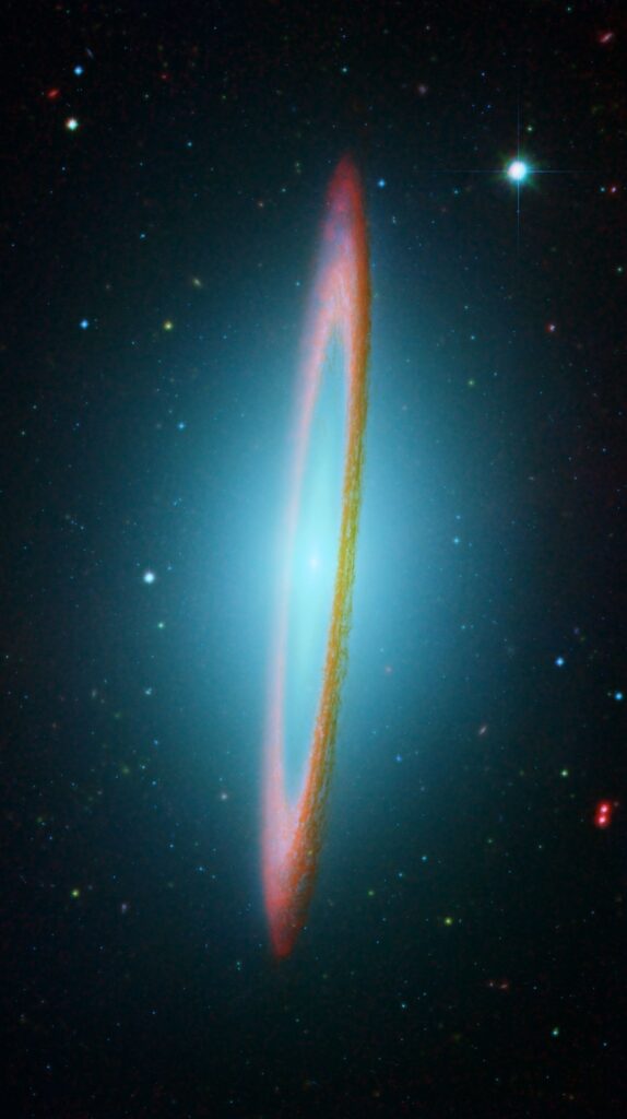 Infrared and visible light composite of the Sombrero Galaxy (M104) showing its bright central bulge and glowing dust ring. Credit: NASA/JPL-Caltech, Hubble.
