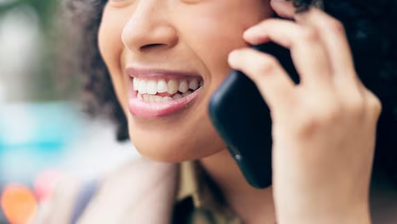 Smiling woman talking on phone