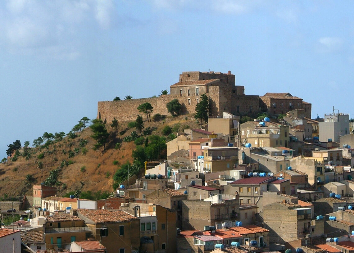 Historic castle overlooking a village.