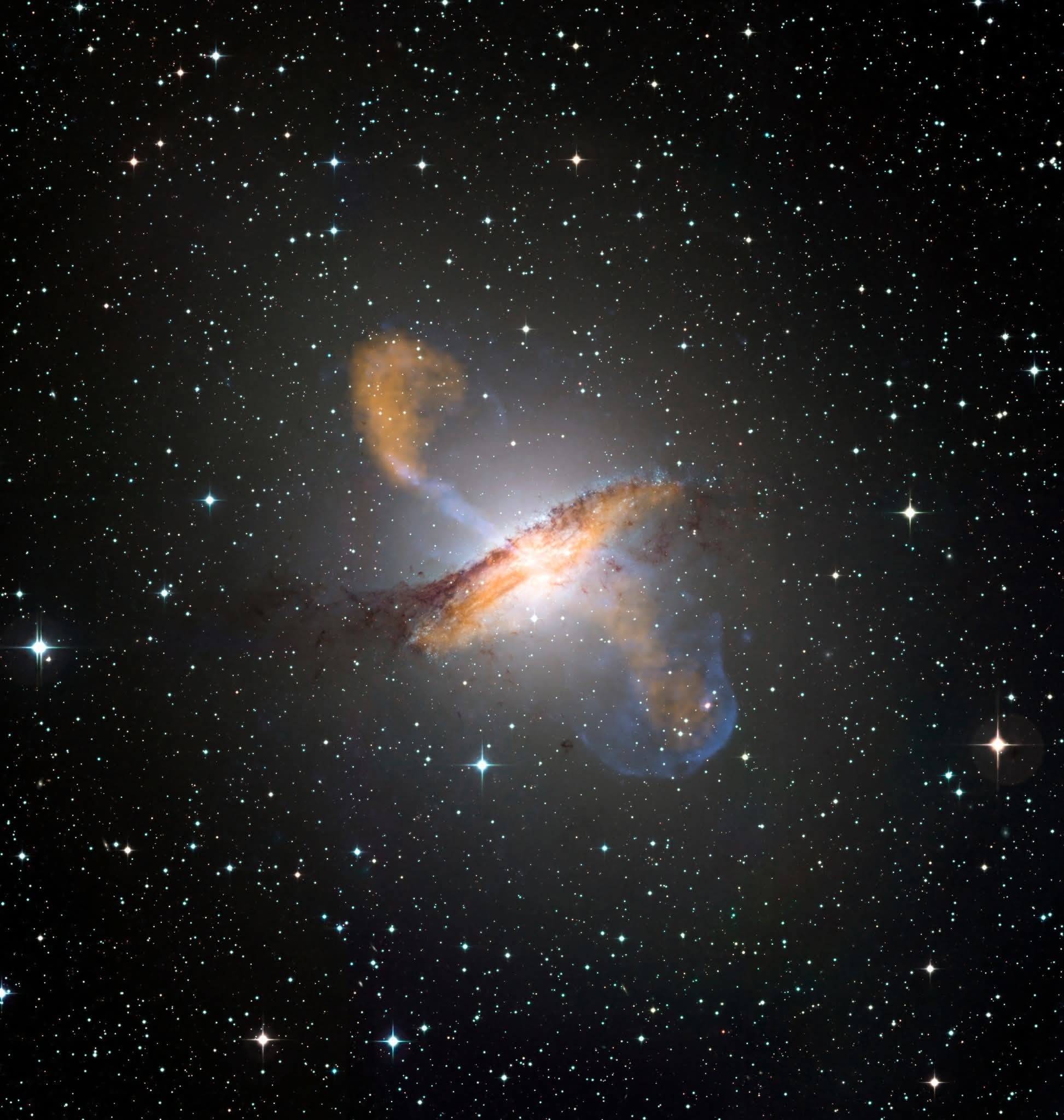 Centaurus A (NGC 5128) multi-wavelength image: APEX submillimeter, Chandra X-ray jets, ESO visible stars, and dust lane.