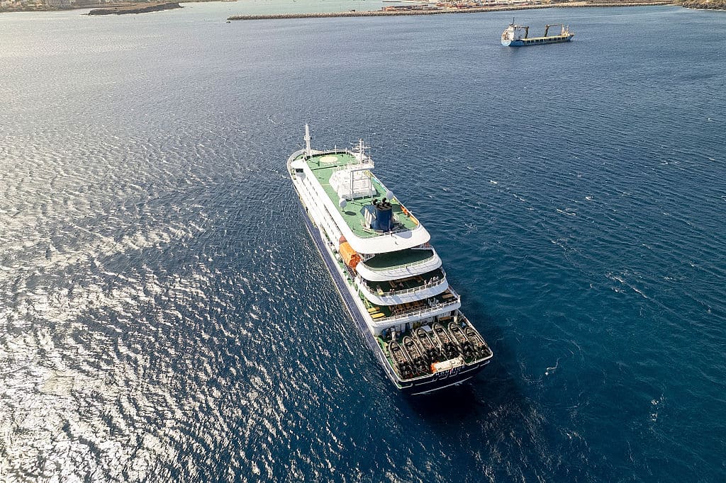 Aerial view of MV Hondius cruise ship anchored off Praia, Cape Verde, during suspected hantavirus outbreak
